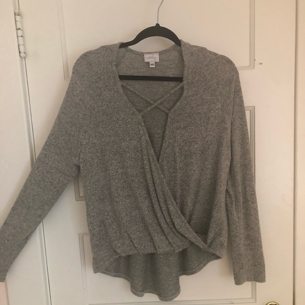 Gray sweater with open cross in the front